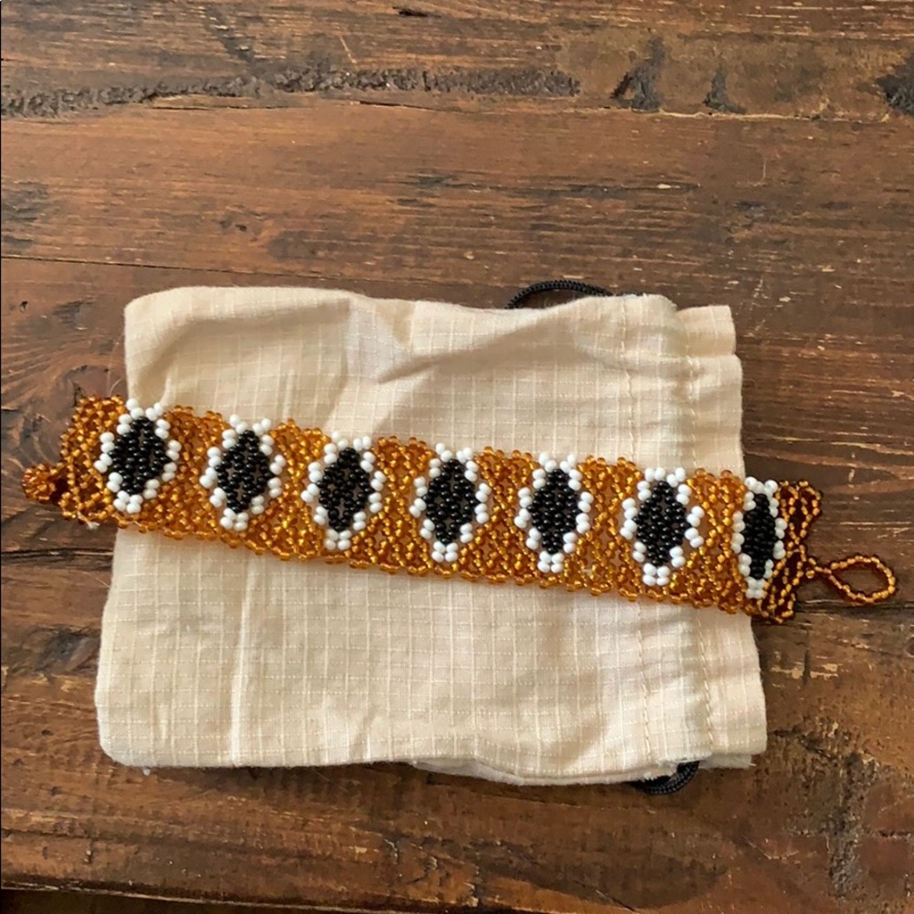 Handmade gold, black & white colored beaded bracelet from Peru